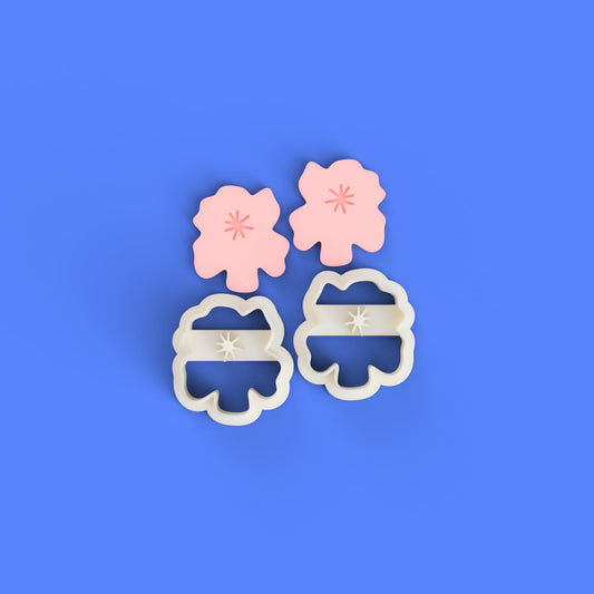 flower shape cutters for clay on a blue background