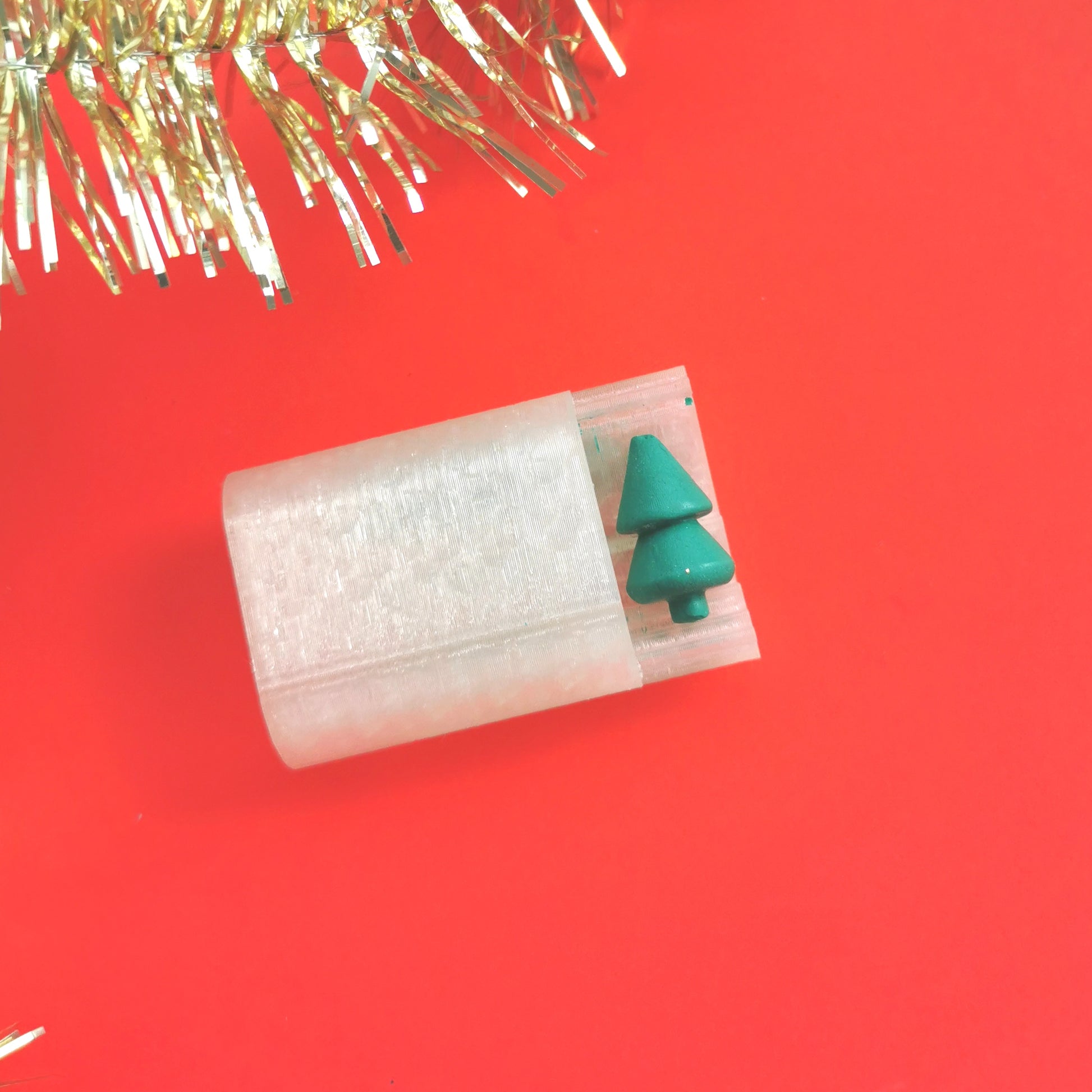 A Christmas tree bead roller for polymer clay.