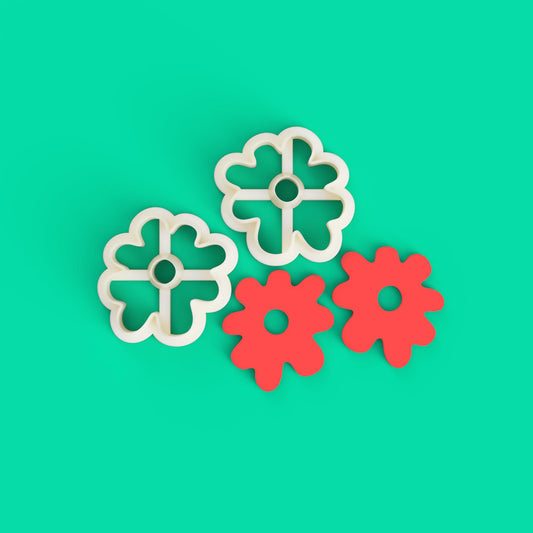 2 ORGANIC flower cutters for polymer clay in a green background