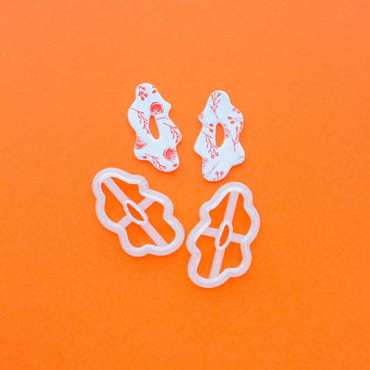 2 organic shape polymer clay cutters in an orange background