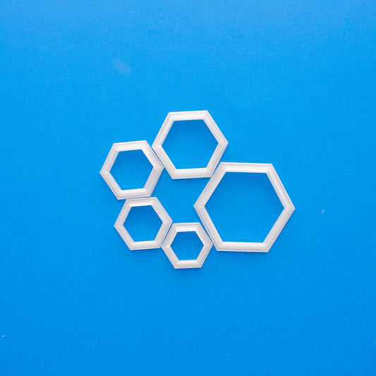 5 Polymer clay cutters hexagon in a blue background