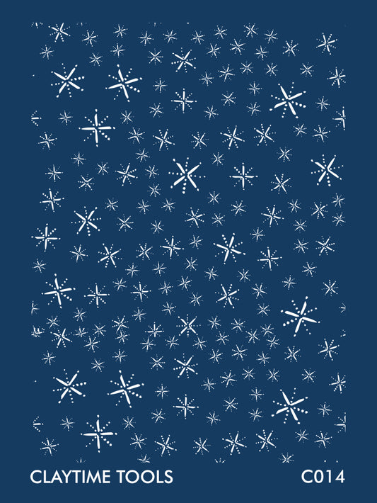 Image of a silkscreen print featuring designs of minimal snowflakes