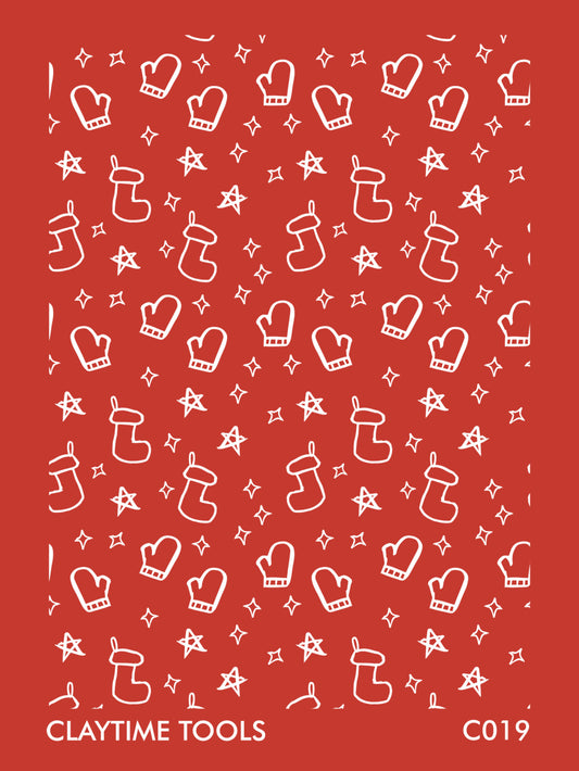 Image of a silkscreen print featuring Christmas themed mittens, socks, and stars.
