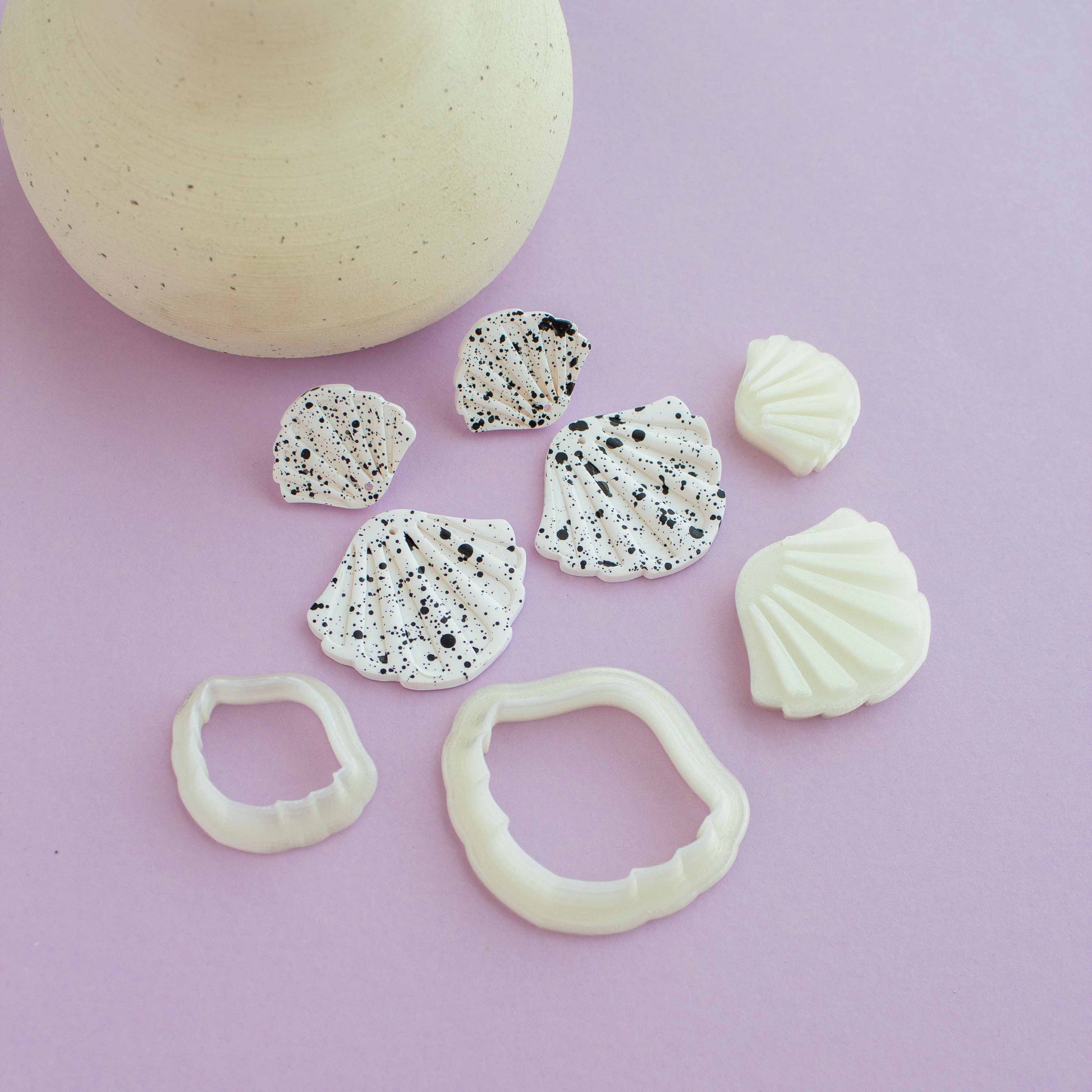 Two shell shaped drop polymer earrings and polymer clay cutters