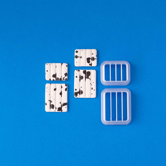Rectangular set of Polymer Clay Cutters on a blue background.