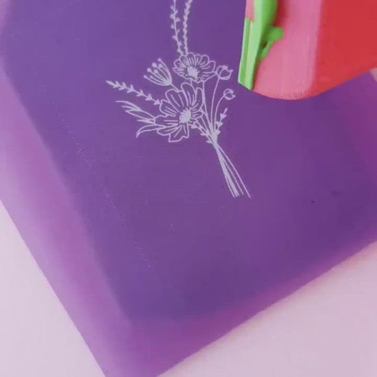 Demonstration of use of mini silkscreen on a slab of polymer clay with acrylic paint