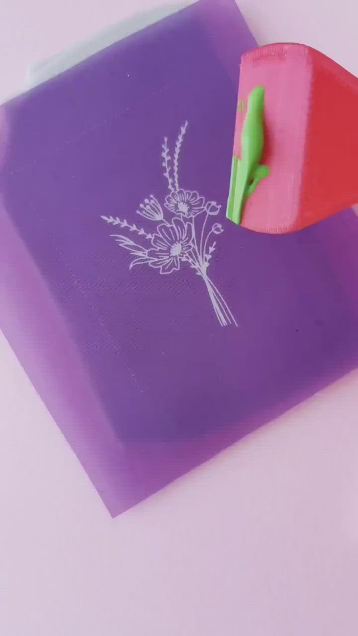 Demonstration of use of mini silkscreen on a slab of polymer clay with acrylic paint