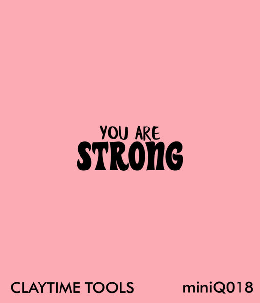 Mini silkscreen "You are strong" on a pink background.
